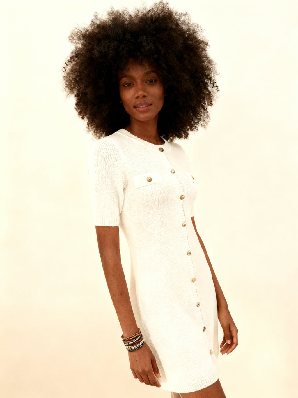 Vestido mini punto botonadura dorada